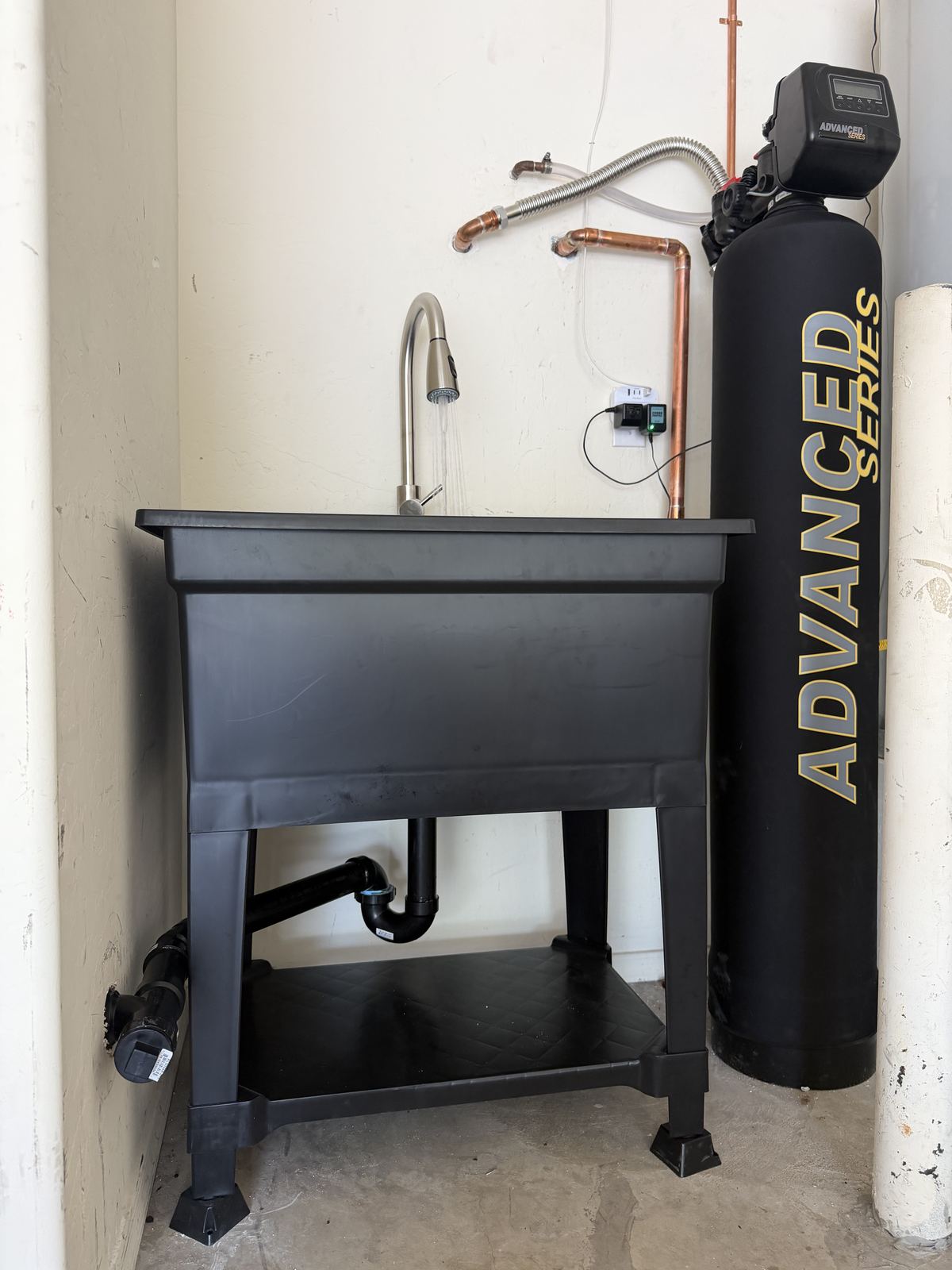 Water softener installation with utility sink setup